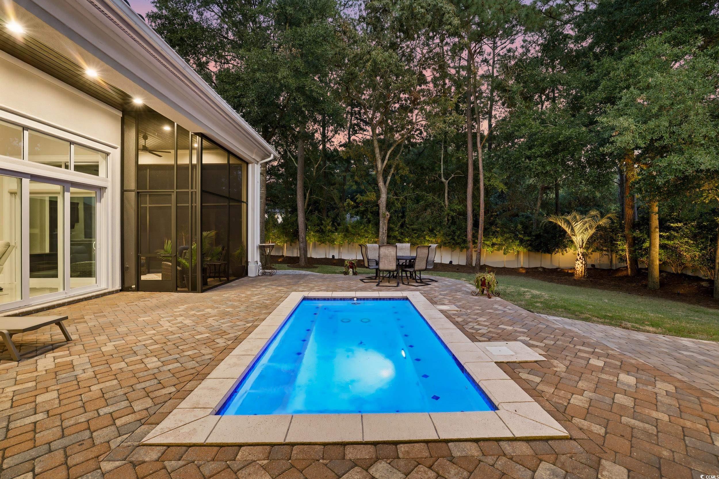 345 Posada Drive Myrtle Beach, SC 29572 - Photo 38 of 39 Outdoor pool with a patio, a fenced backyard, and a private backyard