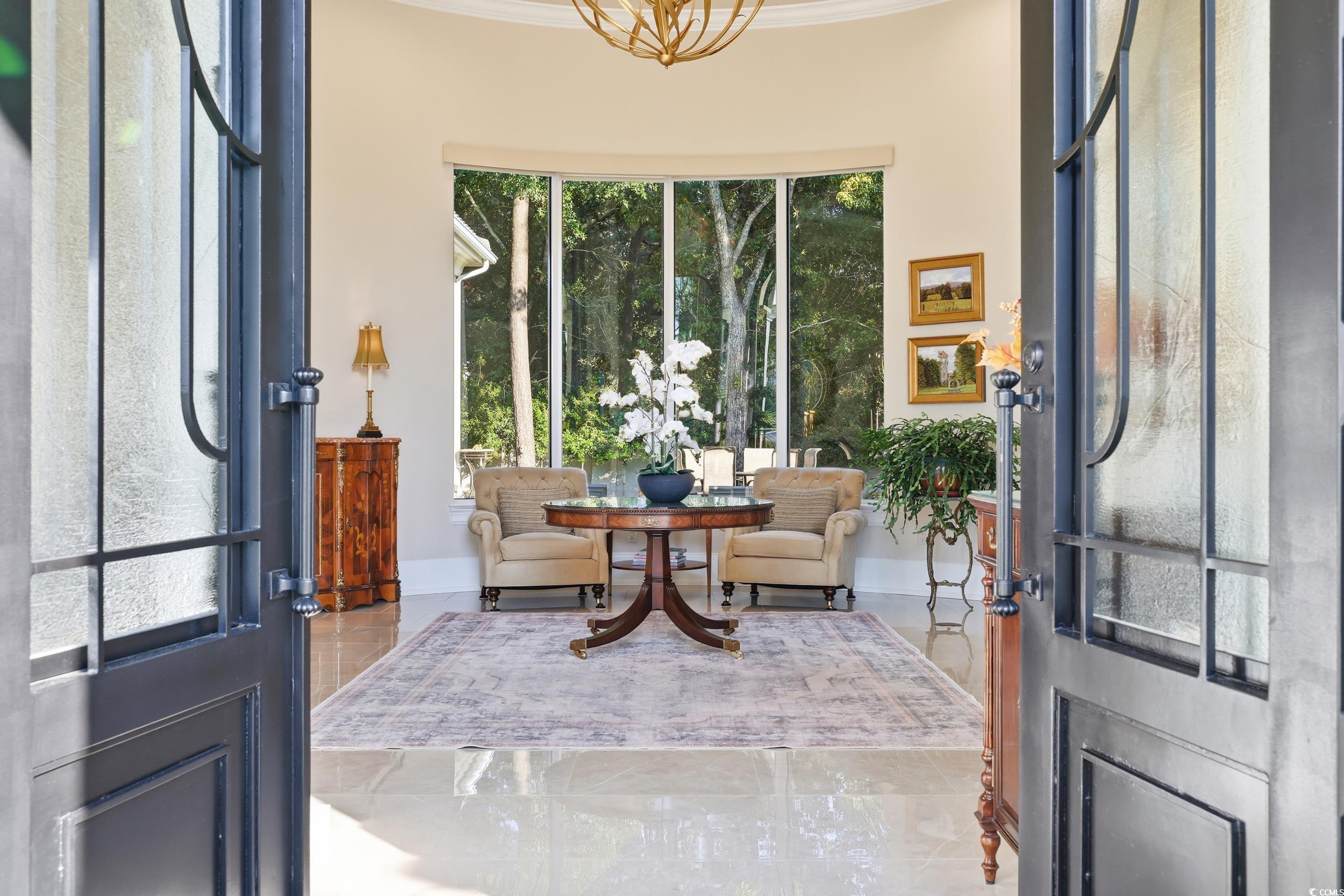 345 Posada Drive Myrtle Beach, SC 29572 - Photo 4 of 39 Entryway featuring tiled floors and crown molding
