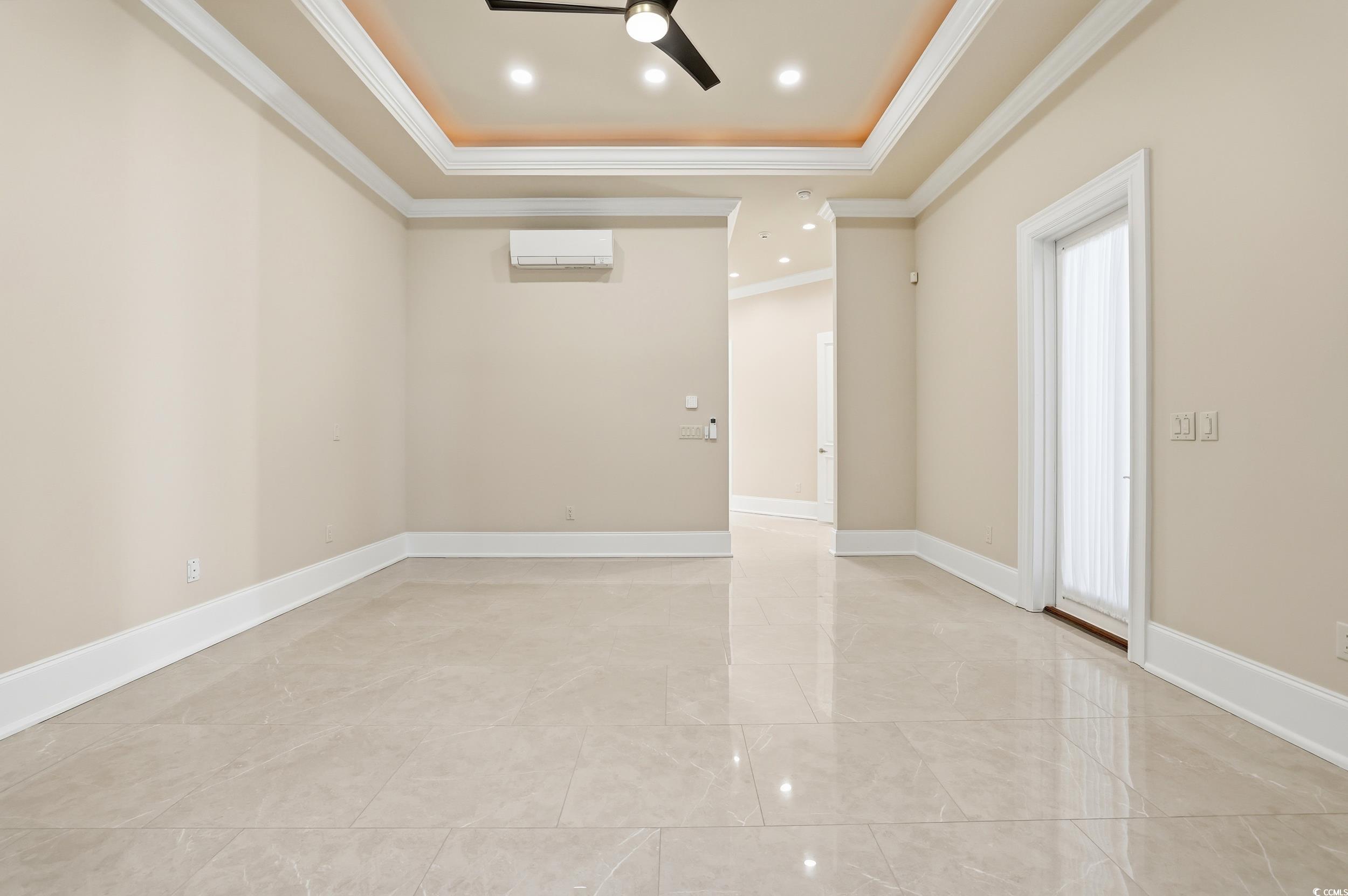 345 Posada Drive Myrtle Beach, SC 29572 - Photo 9 of 40 Primary bedroom featuring a door to the patio, a tray ceiling, recessed lighting, crown molding, ceiling fan