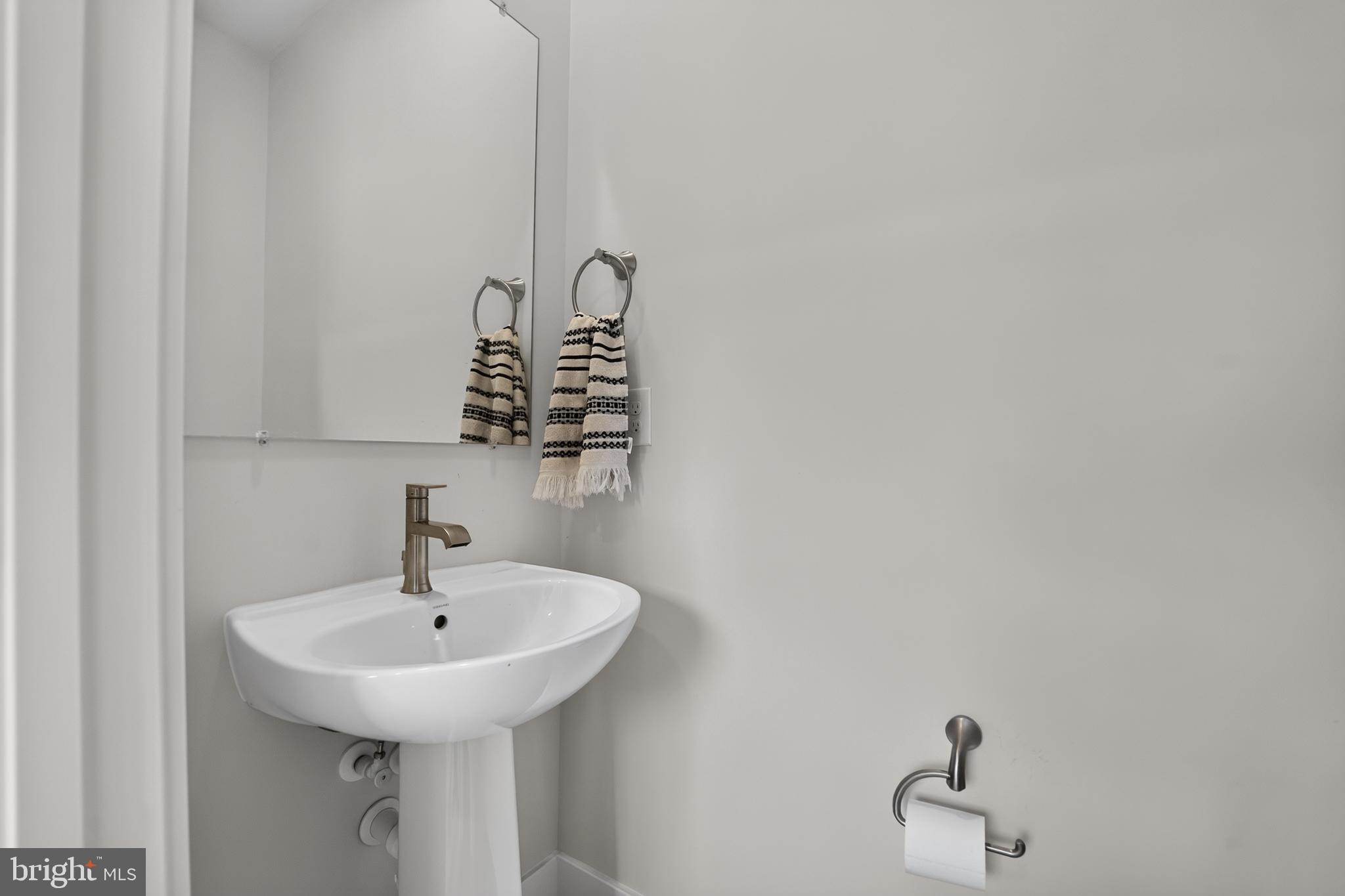 1808 Parham Way Baltimore, MD 21244 - Photo 15 of 31 Sleek and modern powder room design.