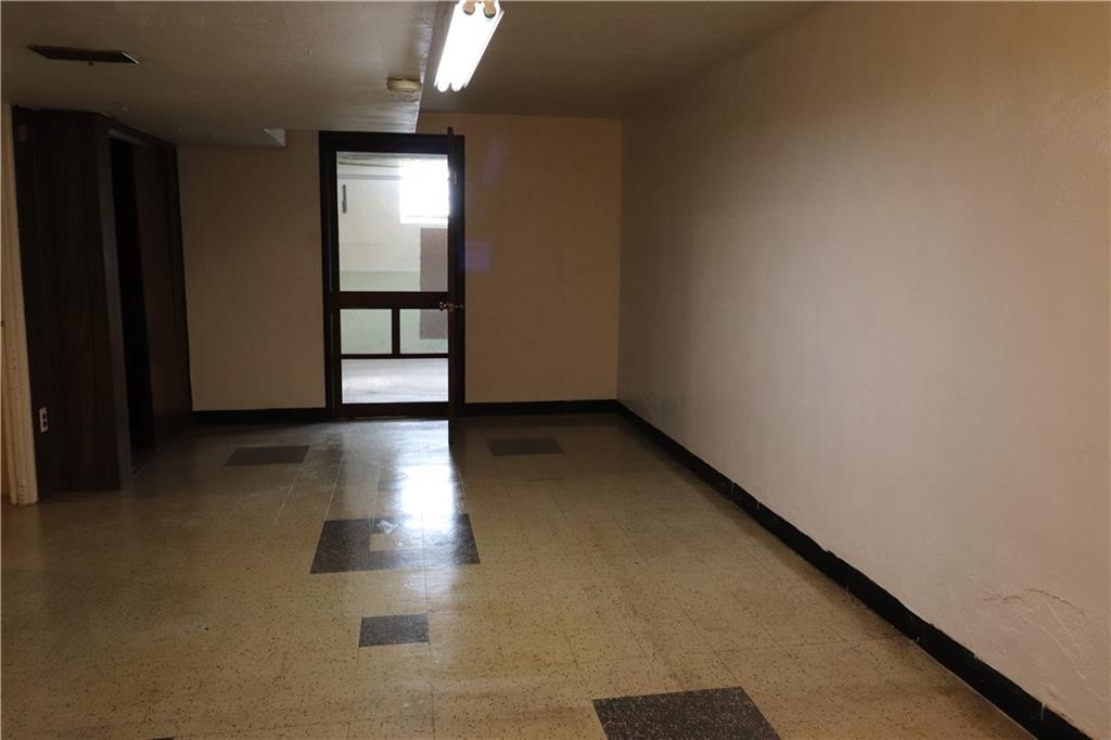 2012 Spring Hill Road Pittsburgh, PA 15243 - Photo 23 of 34 an empty room with wooden floor and windows