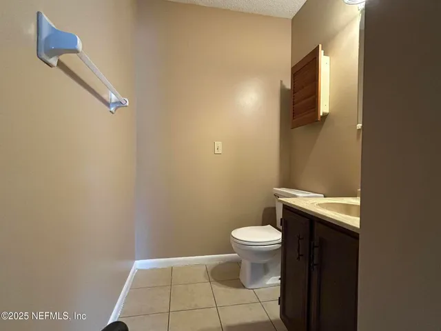a bathroom with a sink and toilet