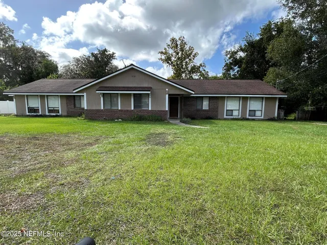 front view of a house with a yard