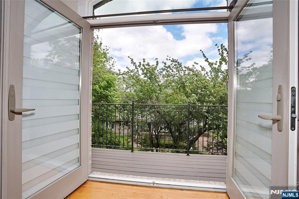 65 Ross Avenue Demarest, NJ 07627 - Photo 26 of 48 a view of a glass door with a outdoor space