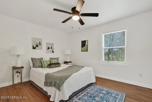 a bedroom with bed and window