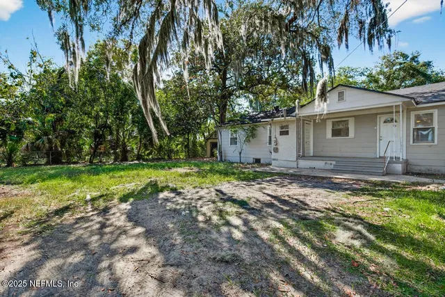 a backyard of a house with lots of green space