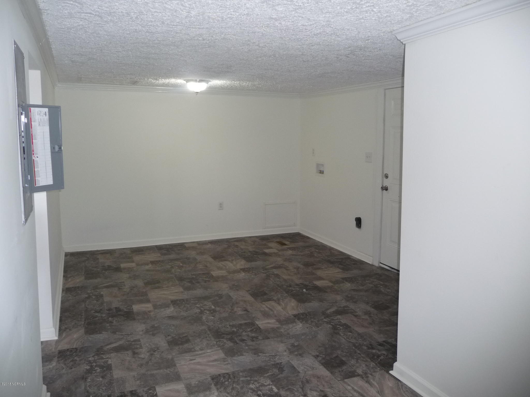 15540 St Johns Church Road Gibson, NC 28343 - Photo 6 of 16 LARGE laundry room with room for freezer and room to add doors for walk in pantry