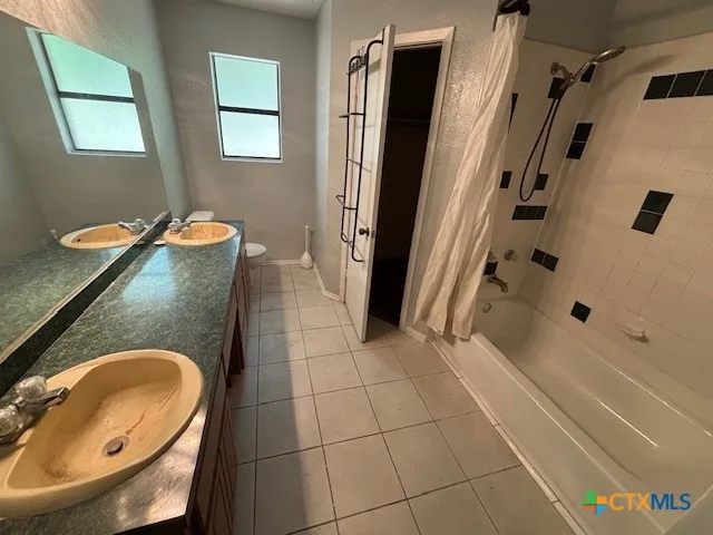 a bathroom with a tub and a sink