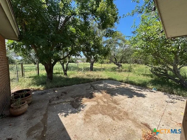 a view of a street with a trees