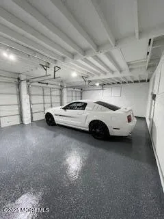 a view of parking garage with cars