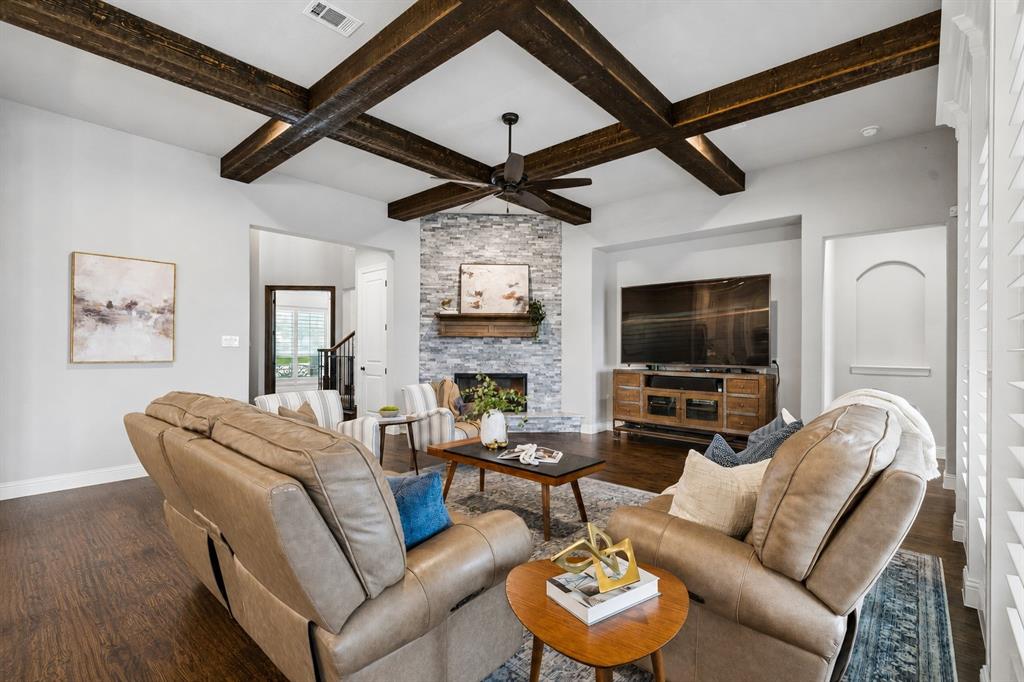 104 Ryder Court Hurst, TX 76053 - Photo 9 of 35 Dramatic Living Room With Austin Stone Fireplace And Exposed Wood Beams