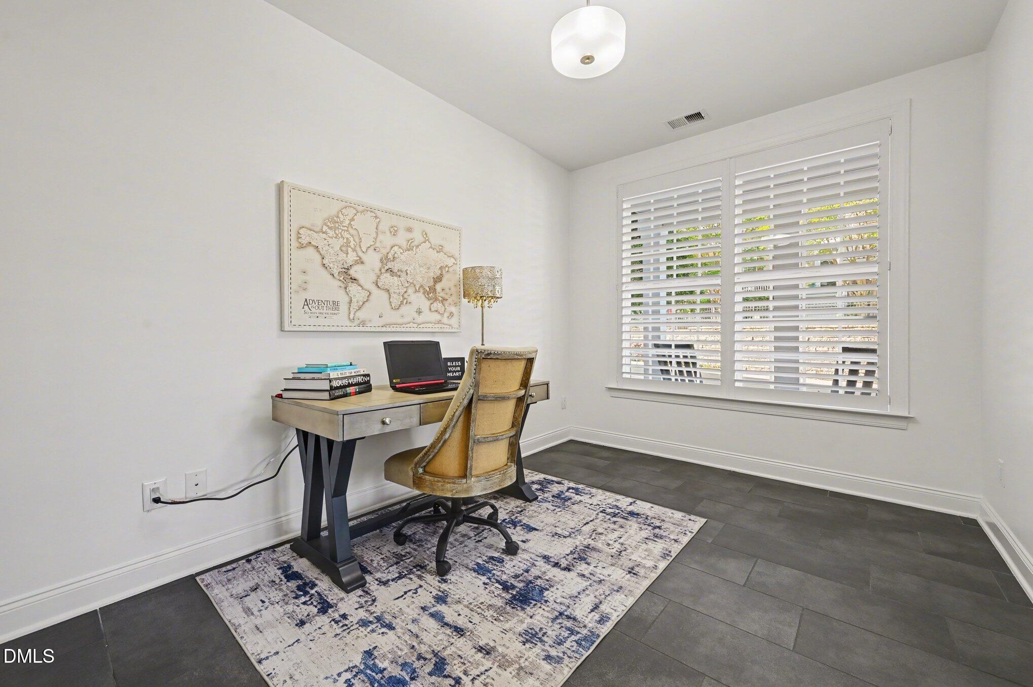 10420 Sablewood Drive, Unit 112 Raleigh, NC 27617 - Photo 12 of 31 a work room with furniture and a window