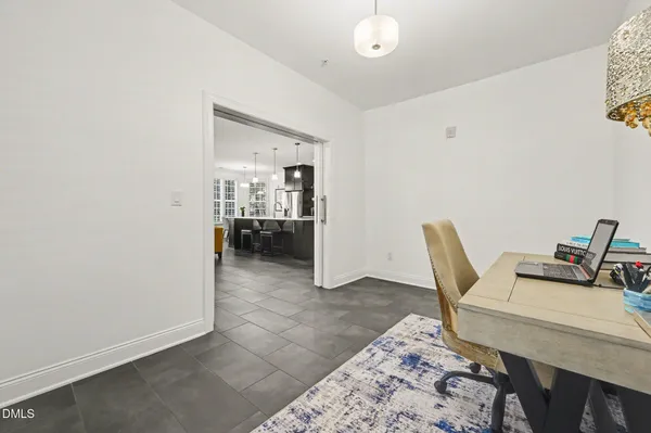a workspace room with furniture