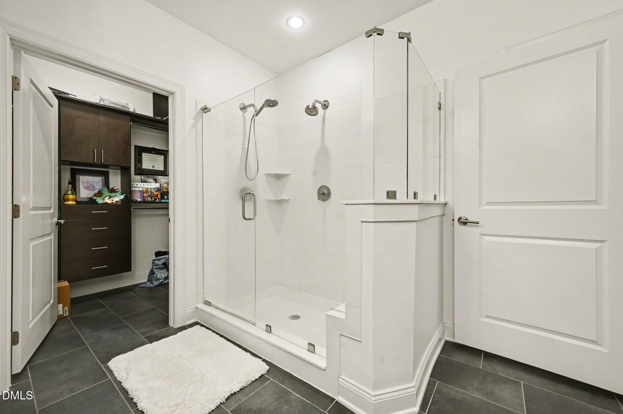 10420 Sablewood Drive, Unit 112 Raleigh, NC 27617 - Photo 17 of 31 a bathroom with a glass shower door