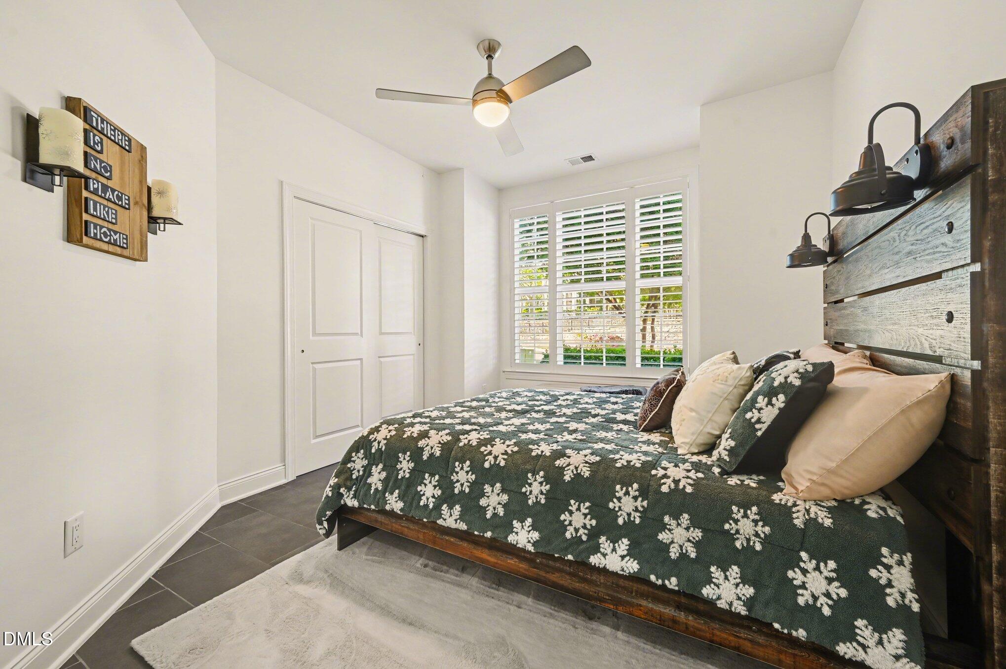 10420 Sablewood Drive, Unit 112 Raleigh, NC 27617 - Photo 19 of 31 a bedroom with a bed and a window
