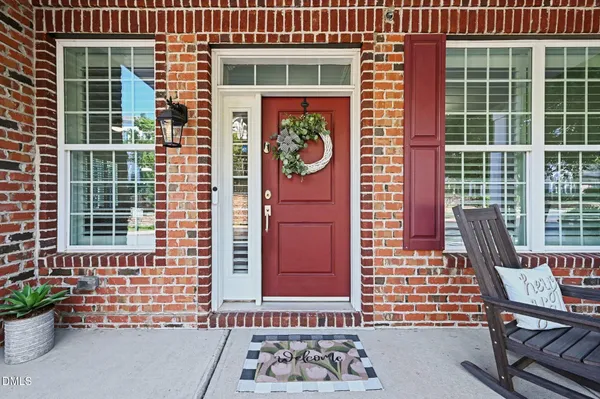 a front view of a house with a glass door