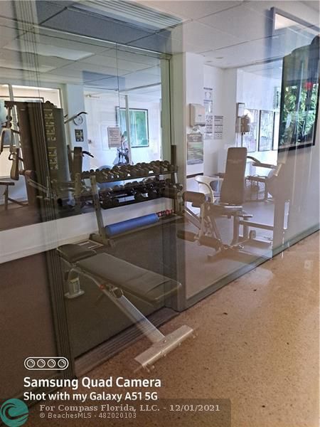 255 West 24th Street, Unit 105 Miami Beach, FL 33140 - Photo 30 of 47 a living room with furniture a flat screen tv and a sink