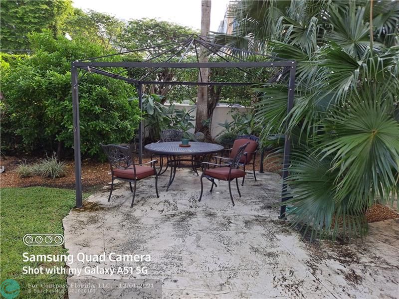 255 West 24th Street, Unit 105 Miami Beach, FL 33140 - Photo 33 of 47 a view of a backyard with sitting area