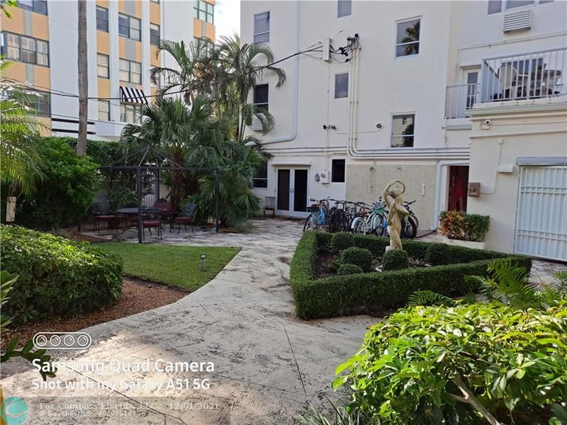 255 West 24th Street, Unit 105 Miami Beach, FL 33140 - Photo 34 of 47 a front view of a house with a yard