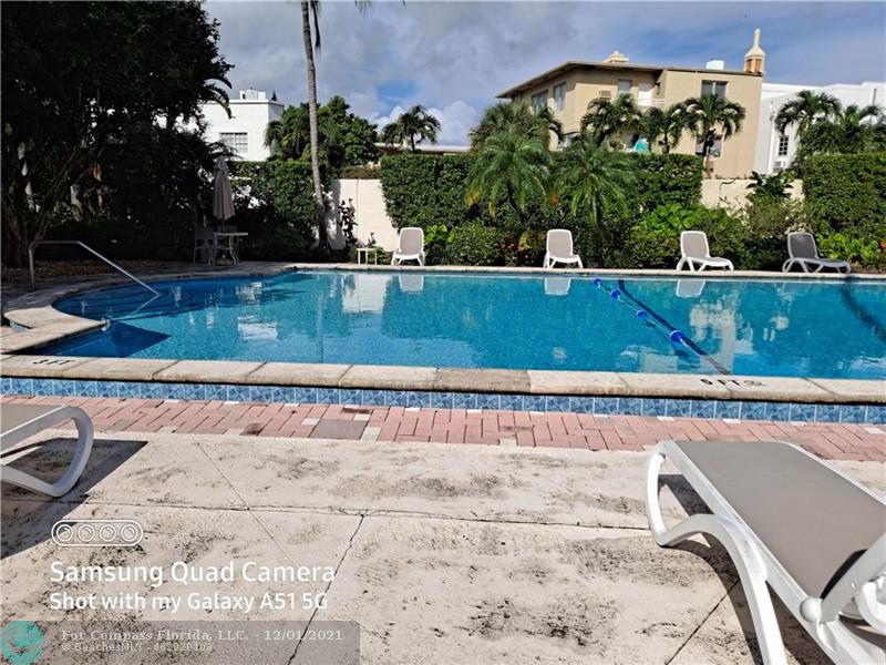 255 West 24th Street, Unit 105 Miami Beach, FL 33140 - Photo 35 of 47 a view of outdoor space yard and swimming pool