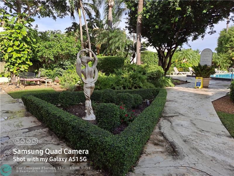 255 West 24th Street, Unit 105 Miami Beach, FL 33140 - Photo 38 of 47 a view of a garden with houses