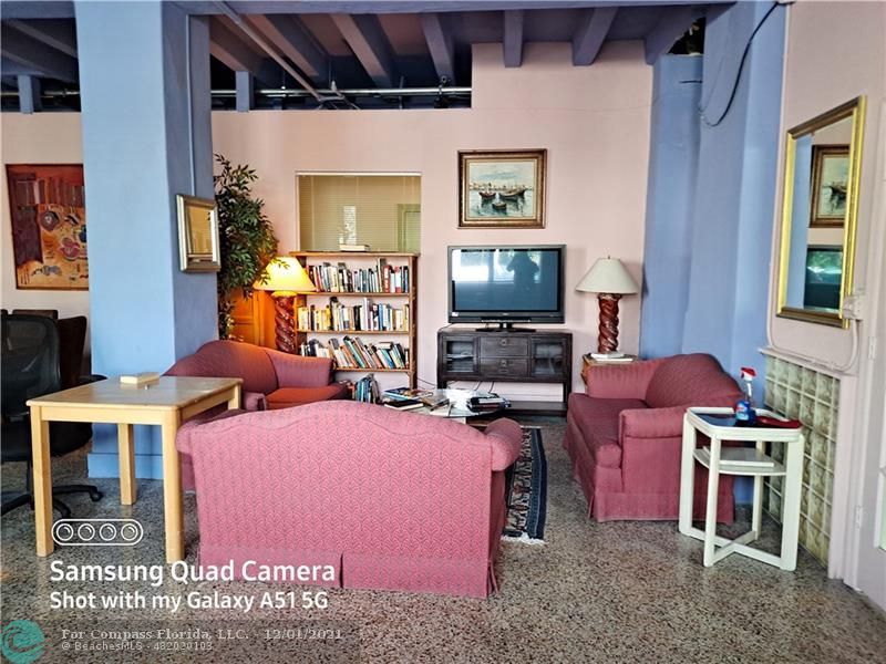 255 West 24th Street, Unit 105 Miami Beach, FL 33140 - Photo 41 of 47 a bedroom with furniture and a flat screen tv