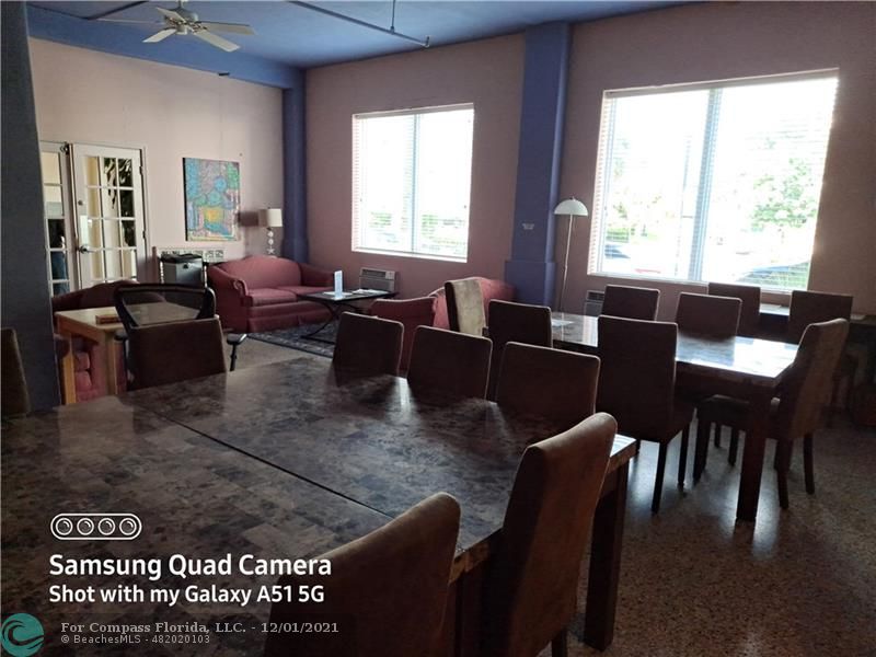 255 West 24th Street, Unit 105 Miami Beach, FL 33140 - Photo 43 of 47 a living room with furniture two window and a table