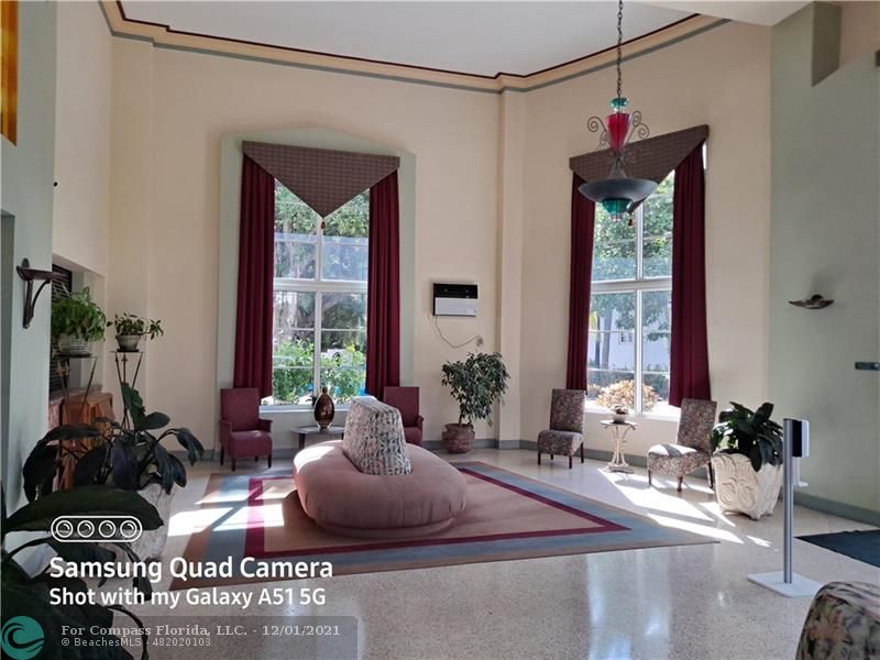 255 West 24th Street, Unit 105 Miami Beach, FL 33140 - Photo 46 of 47 a living room with furniture and a large window