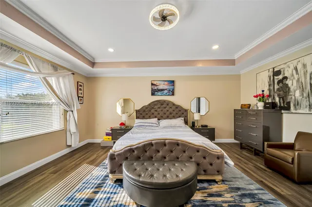 a bedroom with a bed and a desk