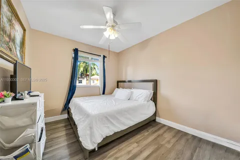 a bedroom with a bed and a desk