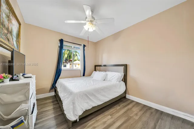 a front view of multiple houses with yard