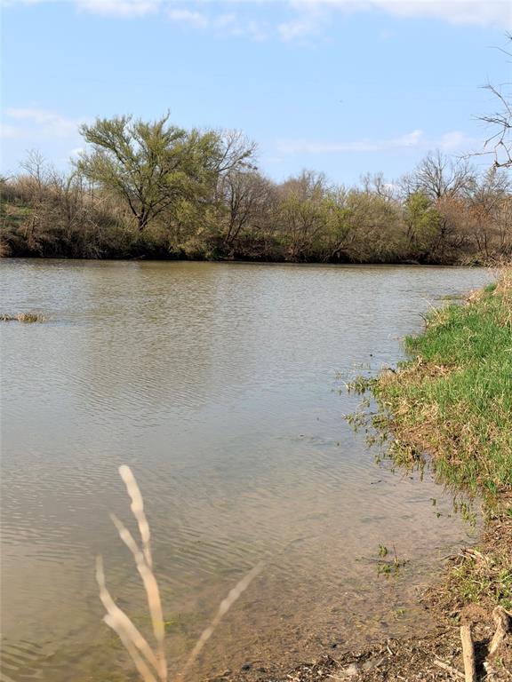 402 County Road 433 Mullin, TX 76864 - Photo 5 of 10 a view of a lake with a mountain in the background