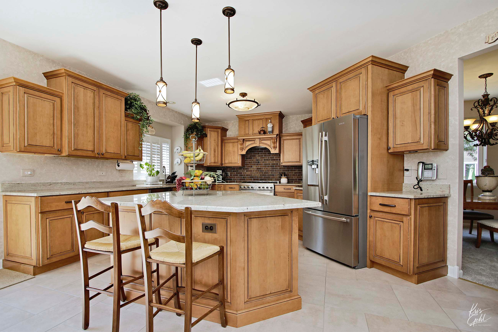 515 Capital Lane Gurnee, IL 60031 - Photo 6 of 32 a kitchen with stainless steel appliances granite countertop a refrigerator a stove a sink dishwasher and a refrigerator with wooden floor
