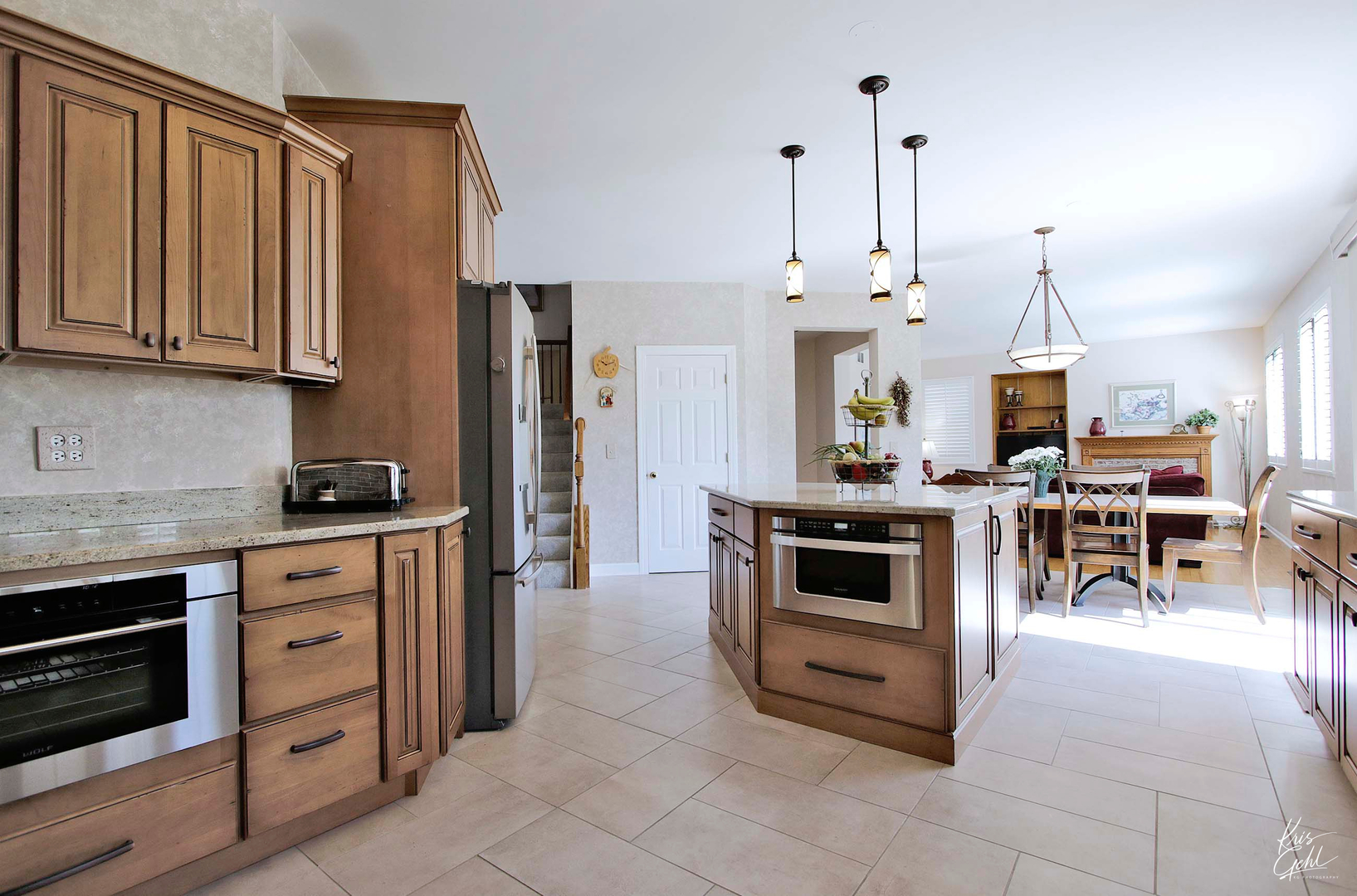 515 Capital Lane Gurnee, IL 60031 - Photo 9 of 32 a kitchen with stainless steel appliances kitchen island granite countertop a stove a sink and a refrigerator