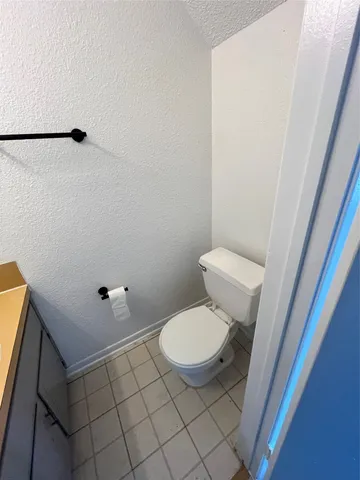 a bathroom with a toilet and a sink