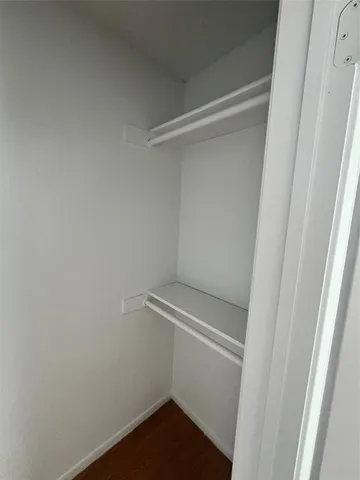 a view of an empty walk in closet