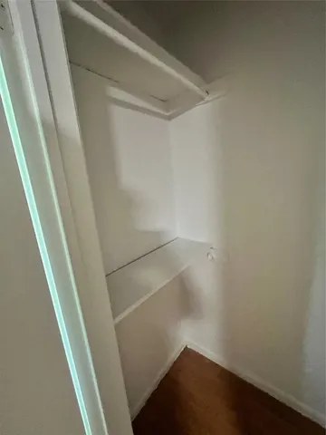 a view of storage and utility room with racks on the wall