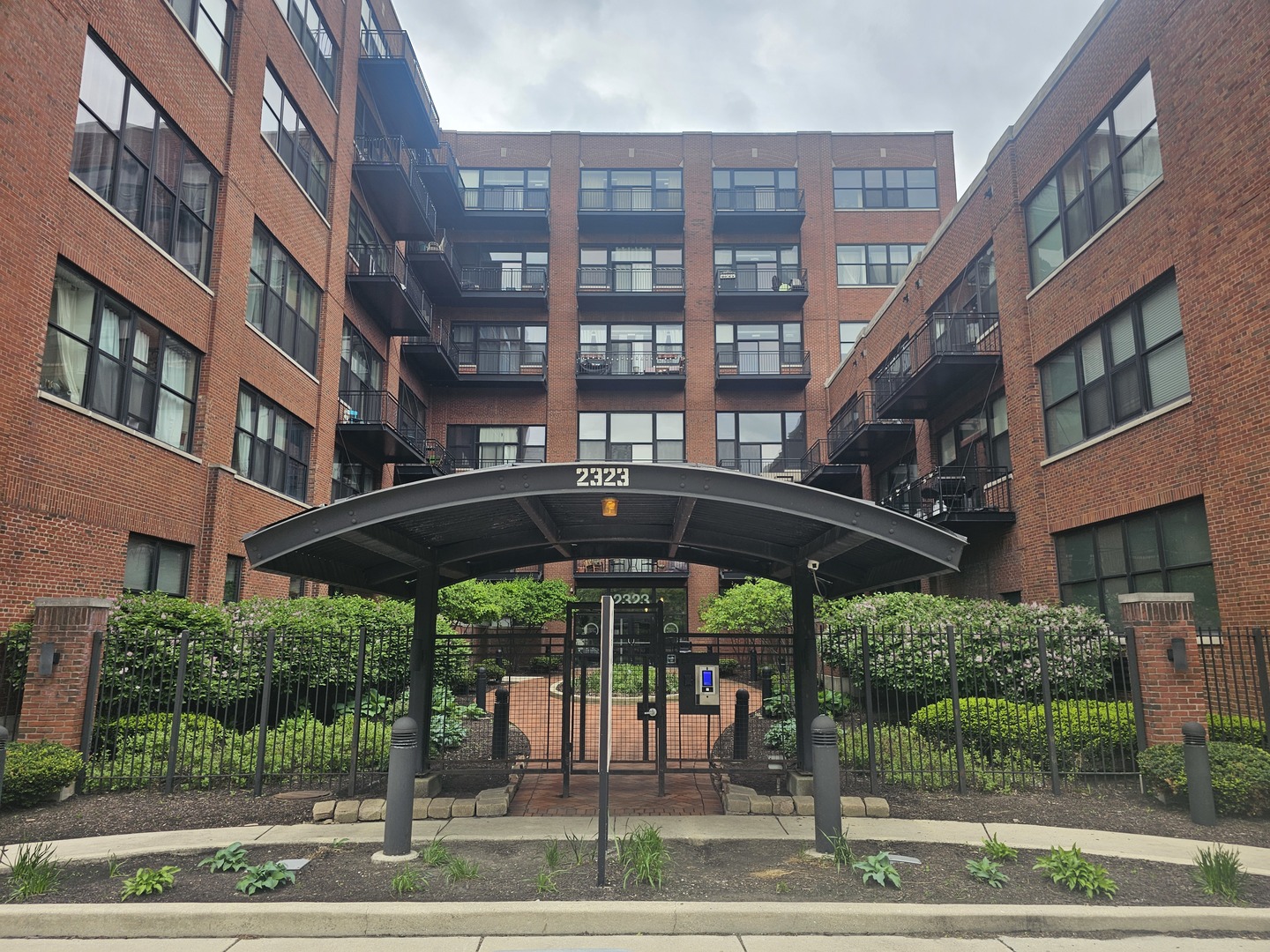 2323 West Pershing Road, Unit 128 Chicago, IL 60609 - Photo 2 of 9 a view of a building with a porch