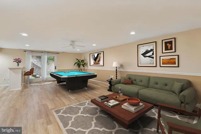 a living room with furniture a rug and a table