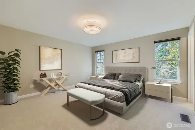 a spacious bedroom with a bed and a couch