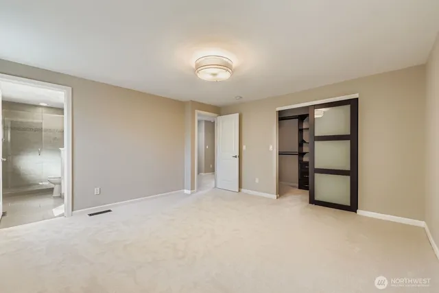 an empty room with a bathroom