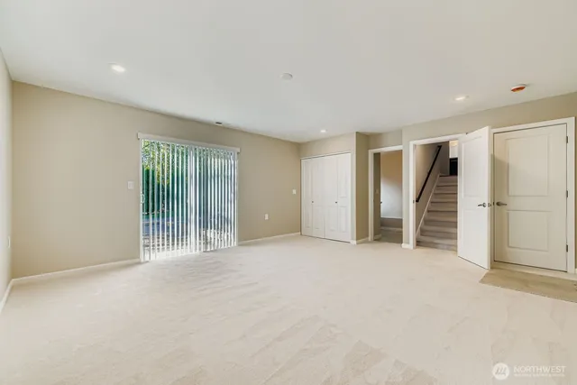 a view of an empty room with a garage