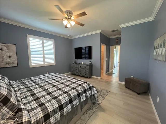 a bathroom with a double vanity sink mirror and bathtub