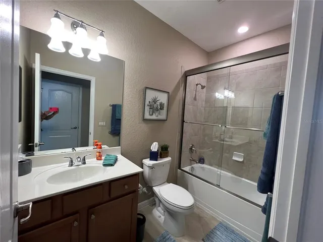 a bathroom with a sink vanity and a mirror