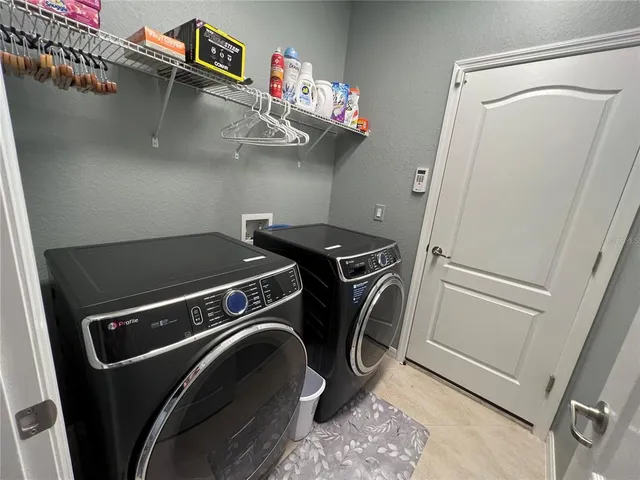 a kitchen with cabinets and window