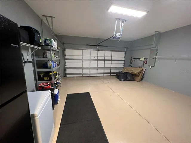 a view of a porch with furniture and wooden floor
