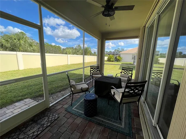 a view of a chairs and table in the balcony