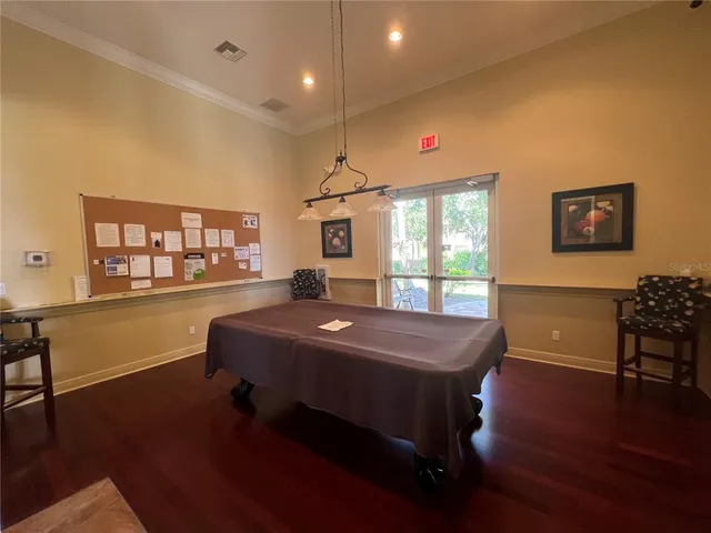 a view of a livingroom with furniture and a ceiling fan