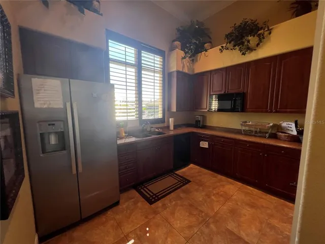a view of a dining room with furniture and a window