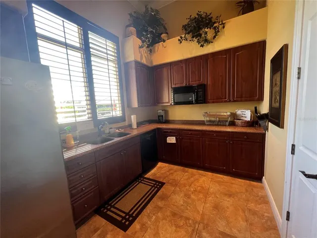 a view of house with yard and entertaining space